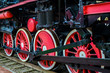 Red train wheels on the rails
