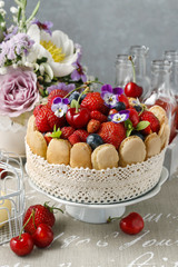 Poster - French charlotte cake with summer fruits decorated with pansy fl