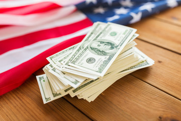 close up of american flag and dollar cash money