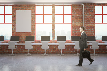 Wall Mural - Walking businessman in brick office