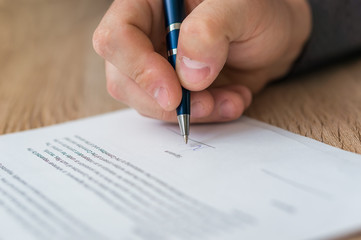 Wall Mural - Businessman is signing a contract to conclude a deal