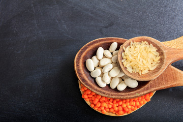 Canvas Print - Lentils, beans and rice in wooden spoons