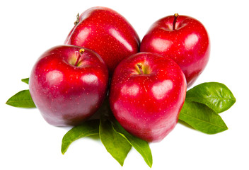 fresh red apples with leaves isolated on white background