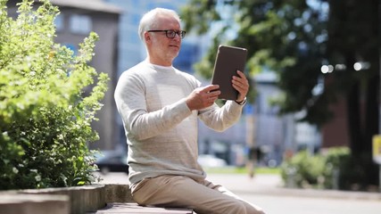 Sticker - senior man having video call on tablet pc in city