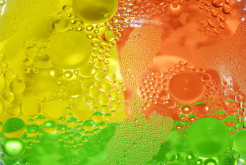  oil bubble floating on water surface in colorful background