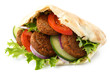 Pita bread filled with falafel and salad isolated on white.