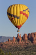© scottevers7 - Hot air balloon rising just after sunrise in Sedona, Arizona