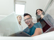 © Myvisuals - succesful creative business people using a laptop during candid