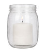 A lit pillar candle in a glass jar isolated on a white background