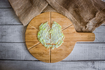 Sliced cabbage on a brown wood board