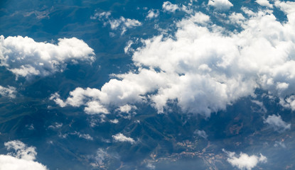 Wall Mural - Aerial view of cloud and sky from airplane window looking down t