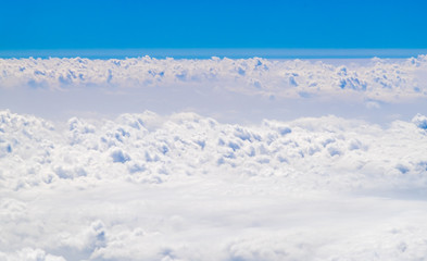 Wall Mural - Aerial view of big cloudy and sky from airplane,Nature backgroun