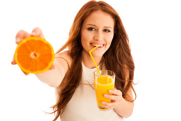 Wall Mural - Woman drinking orange juice smiling showing oranges. Young beaut