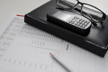 Canvas Print - The document of the report  with phone and notebook on table