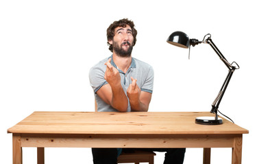 Wall Mural - young man on a table. worried expression