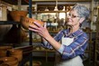 © WavebreakMediaMicro - Female potter placing bowl on shelf