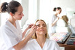 © Production Perig - Two young beautician students working during make up classes