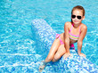 © svetamart - Adorable smiling little girl in swimming pool