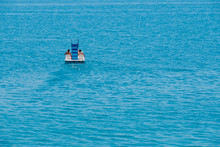 Couple Riding Pedal Boat On A Lake
