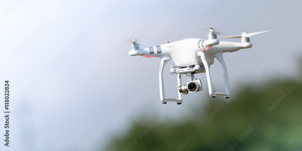 Flying drone in action Stock Photo | Adobe Stock