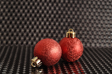 red christmas tree baubles isolated on a black background
