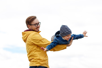 father with son playing and having fun outdoors