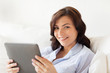© Syda Productions - smiling woman with tablet pc at home