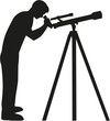 Man looking in telescope