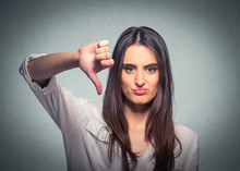 Unhappy Woman Giving Thumb Down Gesture Looking With Negative Expression