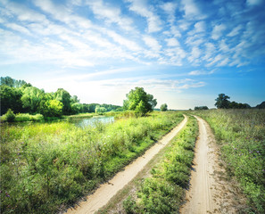 Wall Mural - the sandy road along the river