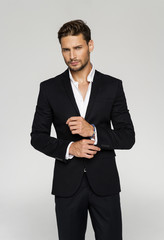 Portrait of handsome man in black suit