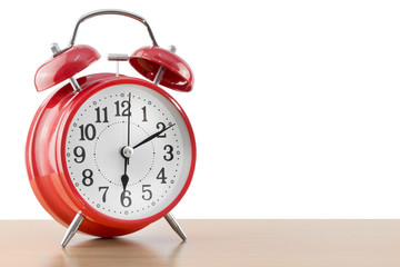 alarm clock on the table on white background.