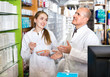 © JackF - Friendly pharmacist and pharmacy technician