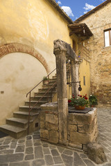 Wall Mural - Ancient Well in Courtyard, Italian City of San Quirico d'Orcia