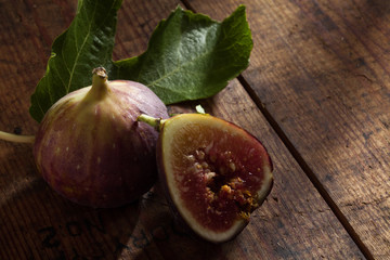 Wall Mural - close up view of fresh figs on color back