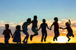 © Africa Studio - Happy kids silhouettes on sunset background
