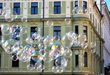 Soap bubble at travelling by European city