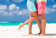 © el.rudakova - leg view of romantic couple hugging at the tropical beach
