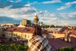 Девушка смотрит на крыши Санкт-Петербурга