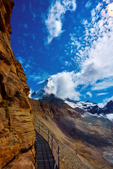 Wall Mural - Snow capped mountains. Matterhorn mount in the clouds. Trek near Matterhorn mount.