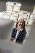 © Westend61 - Smiling senior businesswoman in storeroom
