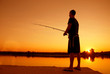 © shoot4pleasure10 - Fishing spinning at sunset. Silhouette of a fisherman