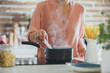 © Lumina Images/Blend Images - Older Caucasian woman cooking in kitchen