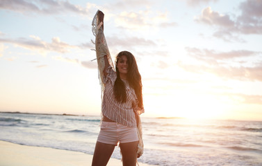 Wall Mural - Beautiful female model having fun on the beach