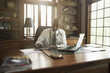 © John Fedele/Blend Images - Black doctor using digital tablet in office
