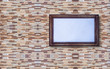 © tapui - Picture frame on the stone wall
