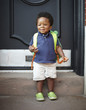 © David A Land/Blend Images - African American baby wearing backpack