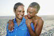 © Peathegee Inc/Blend Images - Older Black women hugging on beach