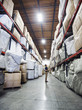 © Erik Isakson/Blend Images - Caucasian worker checking inventory in warehouse