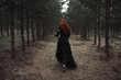 © Marat Safin/Blend Images - Caucasian woman walking on forest path